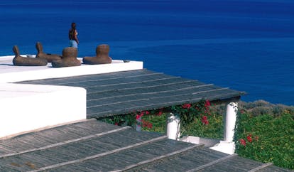Capofaro Hotel Sicily roof terrace outdoor seating area overlooking the sea