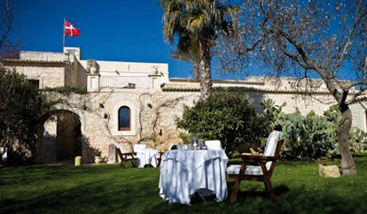 Eremo Della Giubiliana Sicily gardens tables and chairs lawn trees shrubs