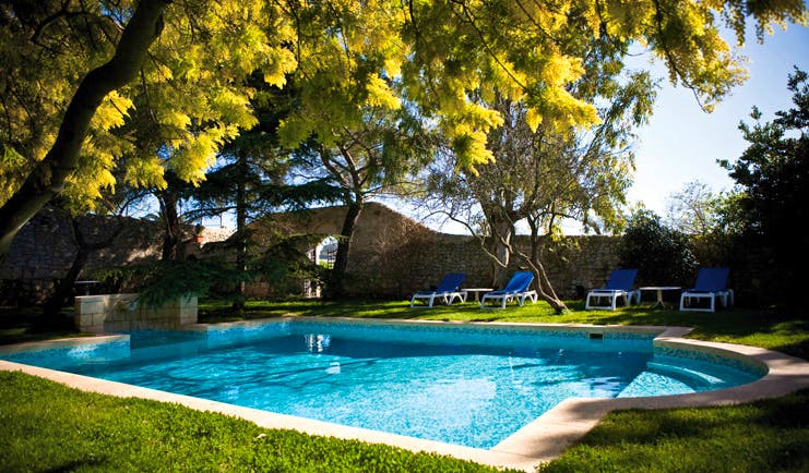 Eremo Della Giubiliana Sicily pool sun loungers lawns trees