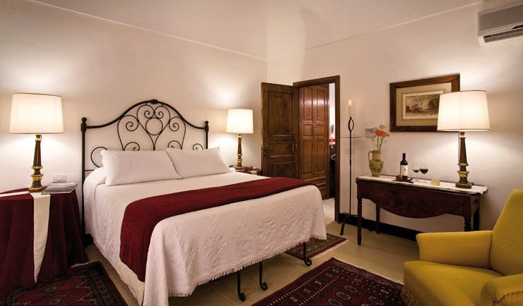 Eremo Della Giubiliana Sicily standard room bed armchair modern décor