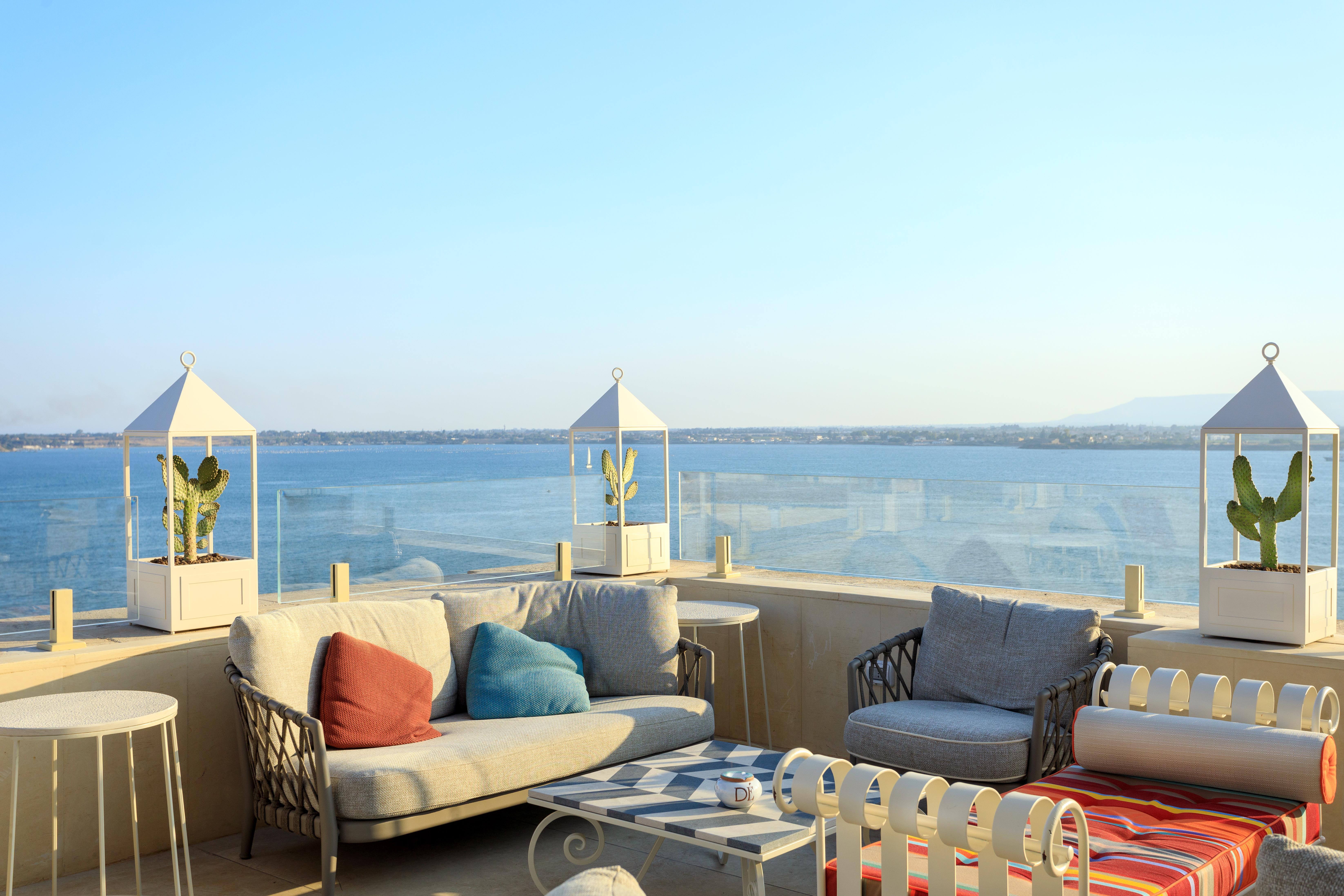 Grand hotel on waterfront in historic town of Ortigia