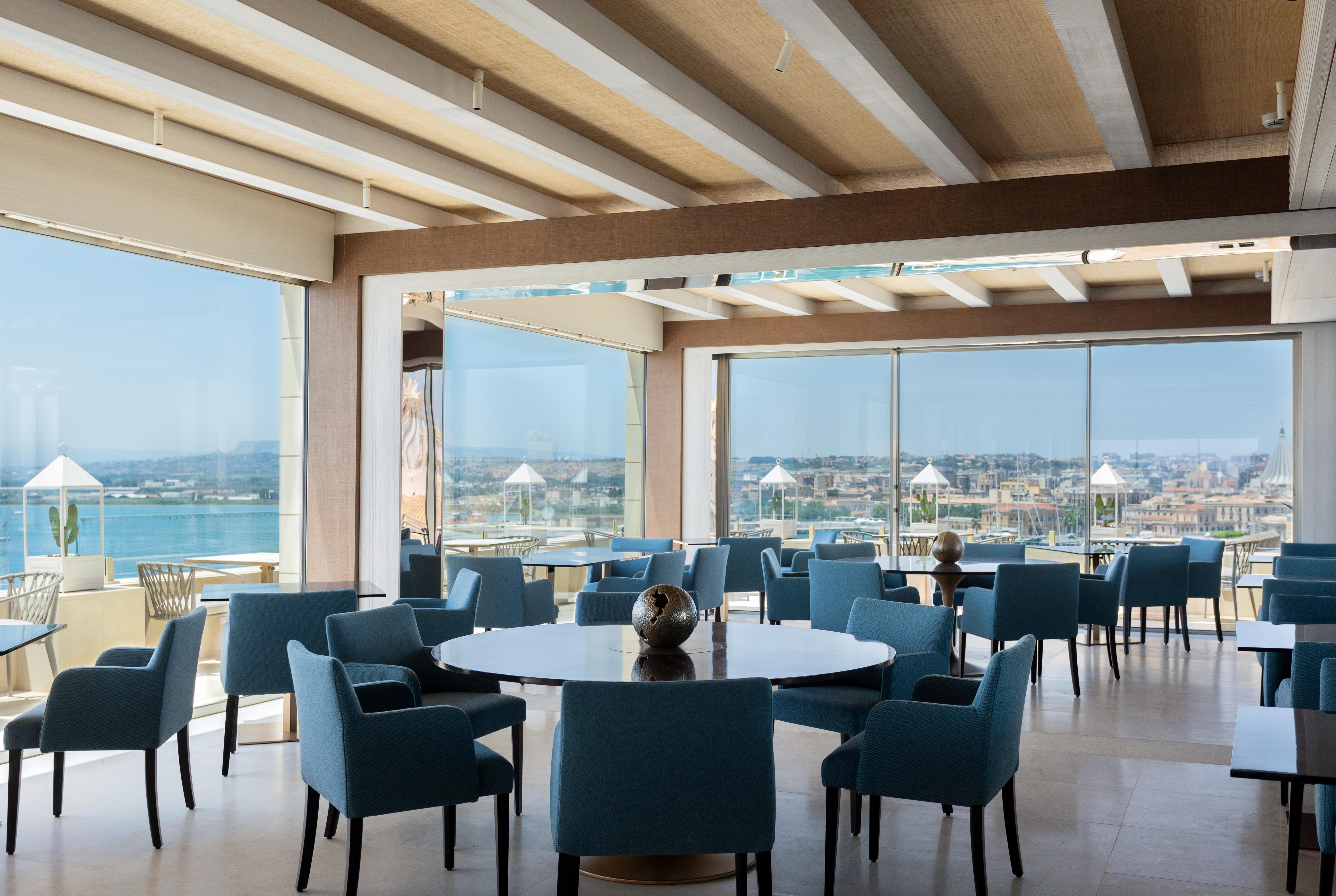 Grand hotel on waterfront in historic town of Ortigia