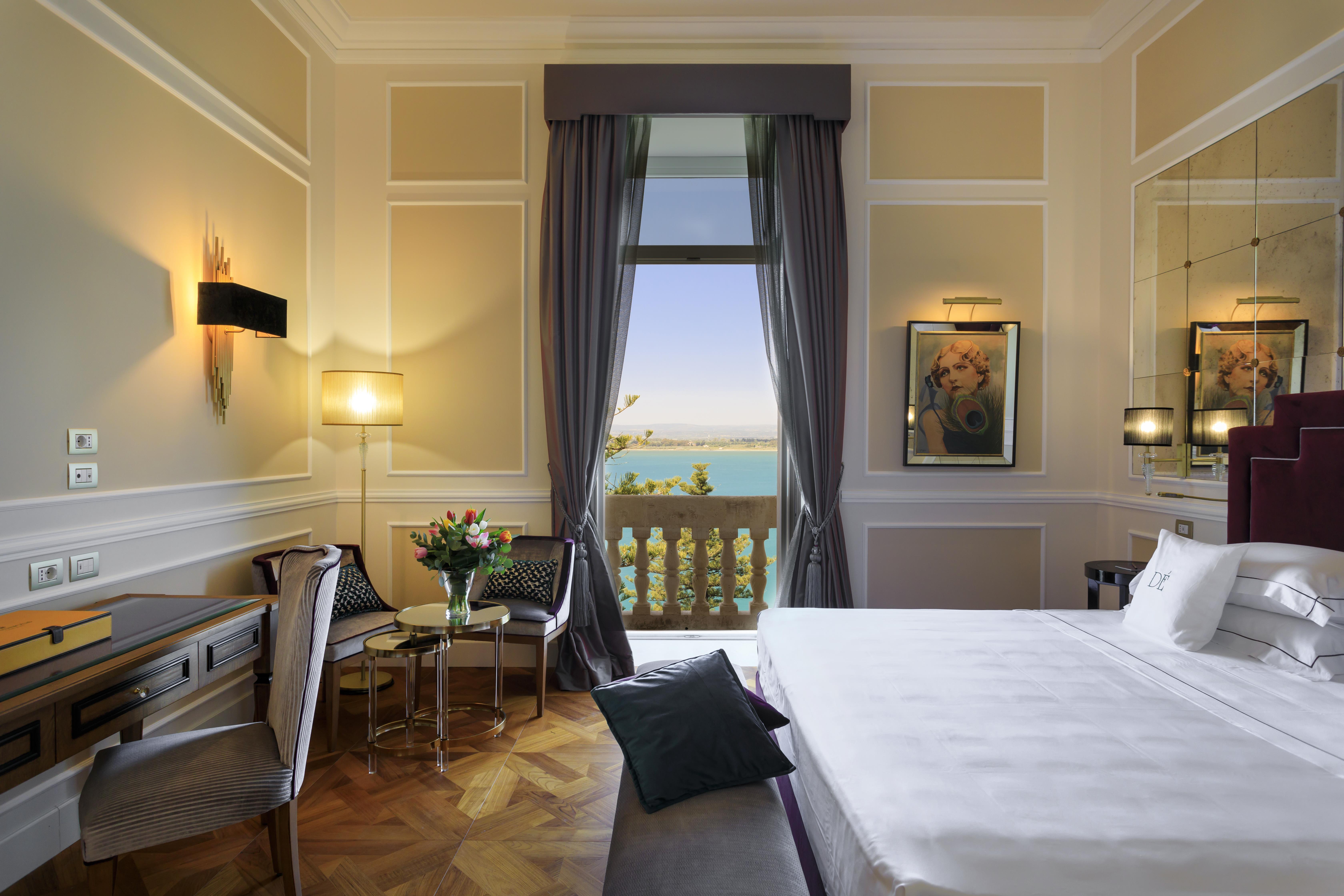 Grand hotel on waterfront in historic town of Ortigia