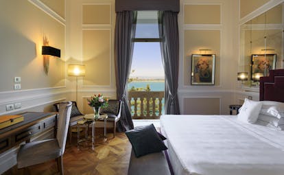 Grand hotel on waterfront in historic town of Ortigia