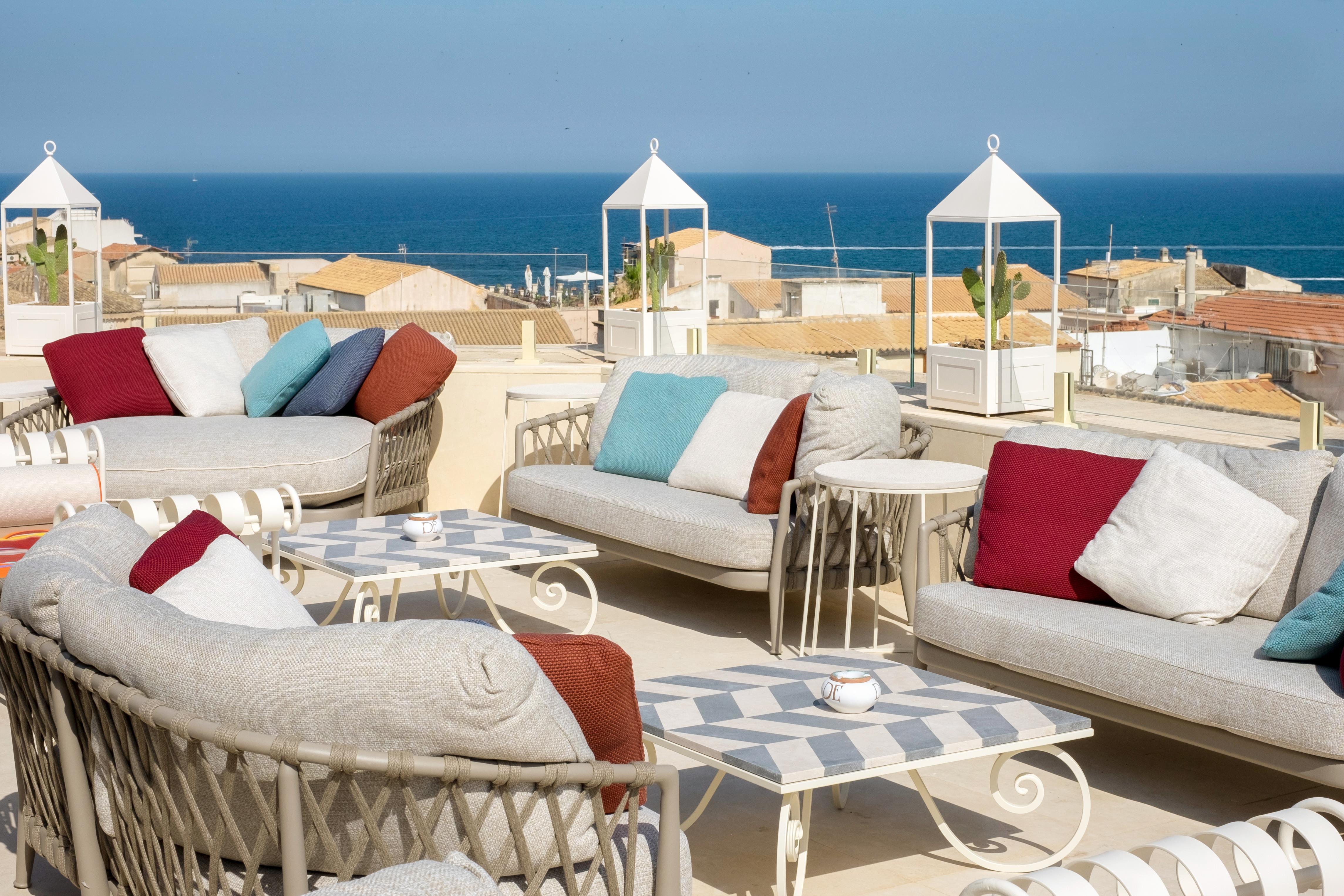 Grand hotel on waterfront in historic town of Ortigia