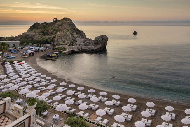 Mazzaro Sea Palace Sicily beach umbrellas sun loungers