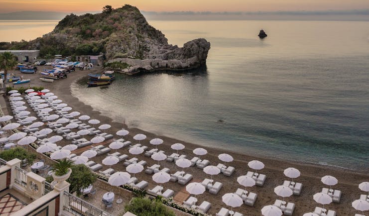 Mazzaro Sea Palace Sicily beach umbrellas sun loungers