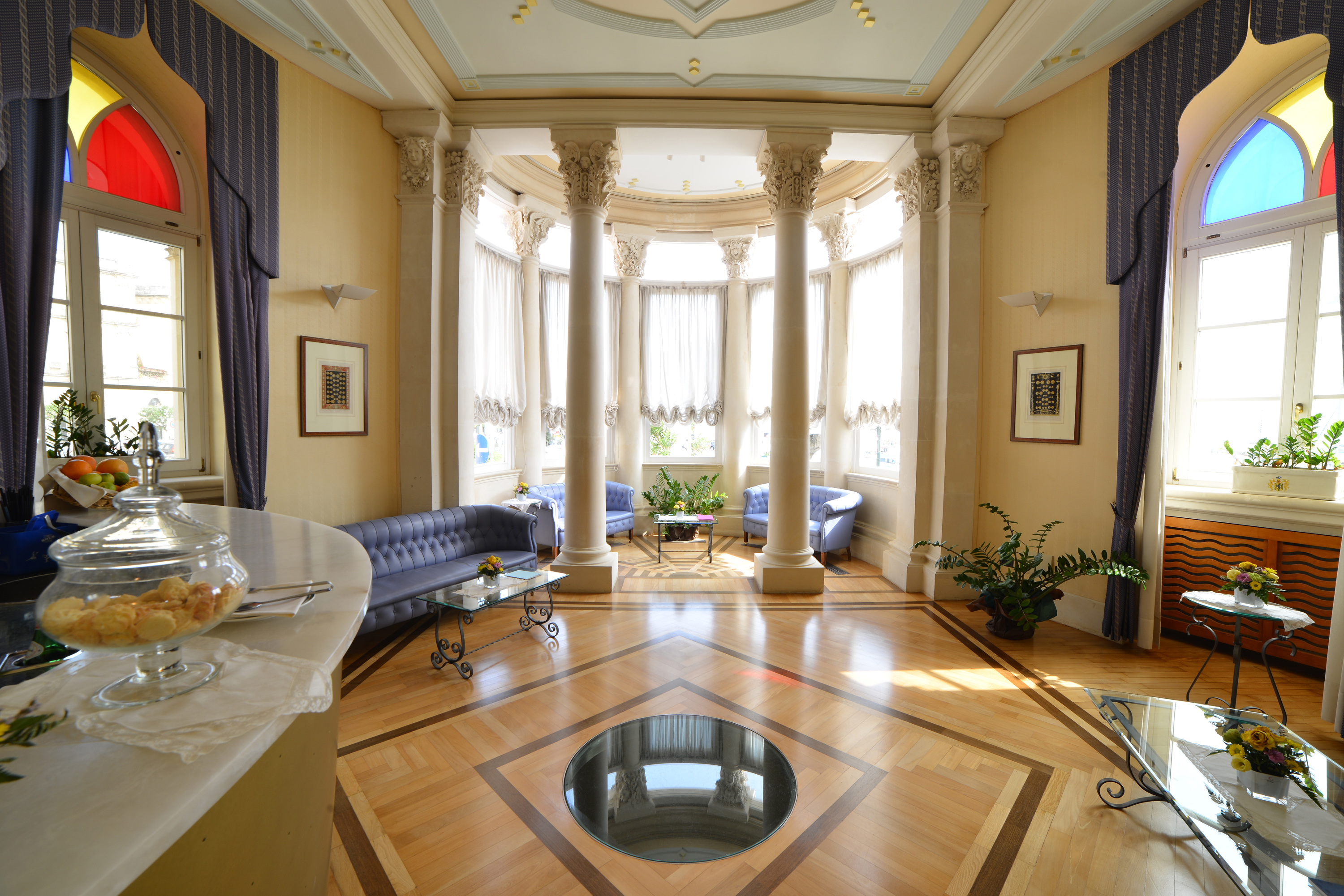 Bar Athena indoor bar with columns around the room and seating areas 