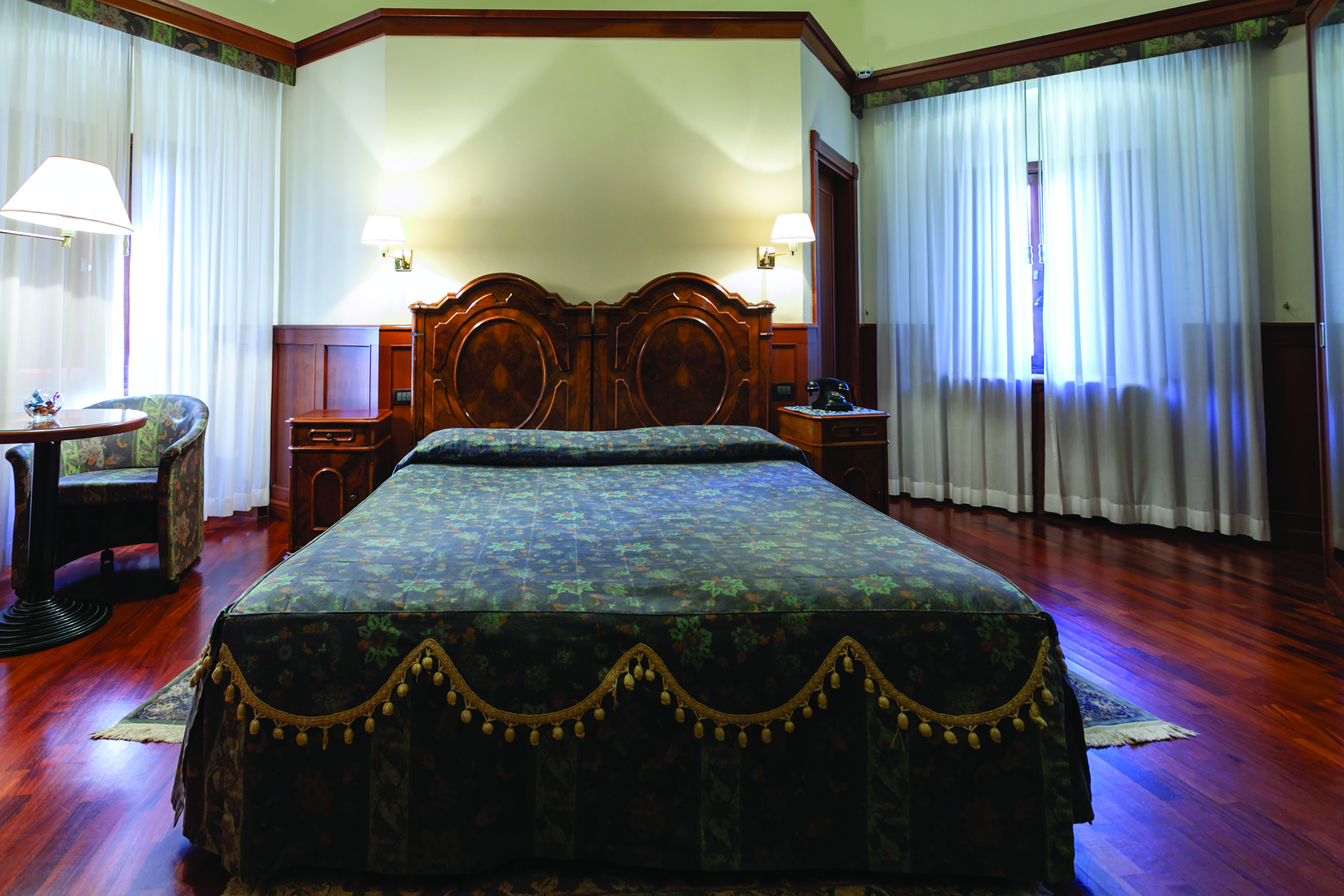 Hotel Baglio Della Luna Sicily deluxe room bed television traditional décor