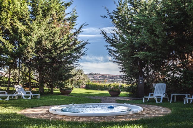 Hotel Baglio Della Luna Sicily outdoor jacuzzi lawns trees views of town