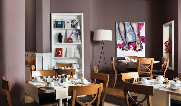 Hotel Principe di Villafranca breakfast room, tables and chairs, elegant modern decor