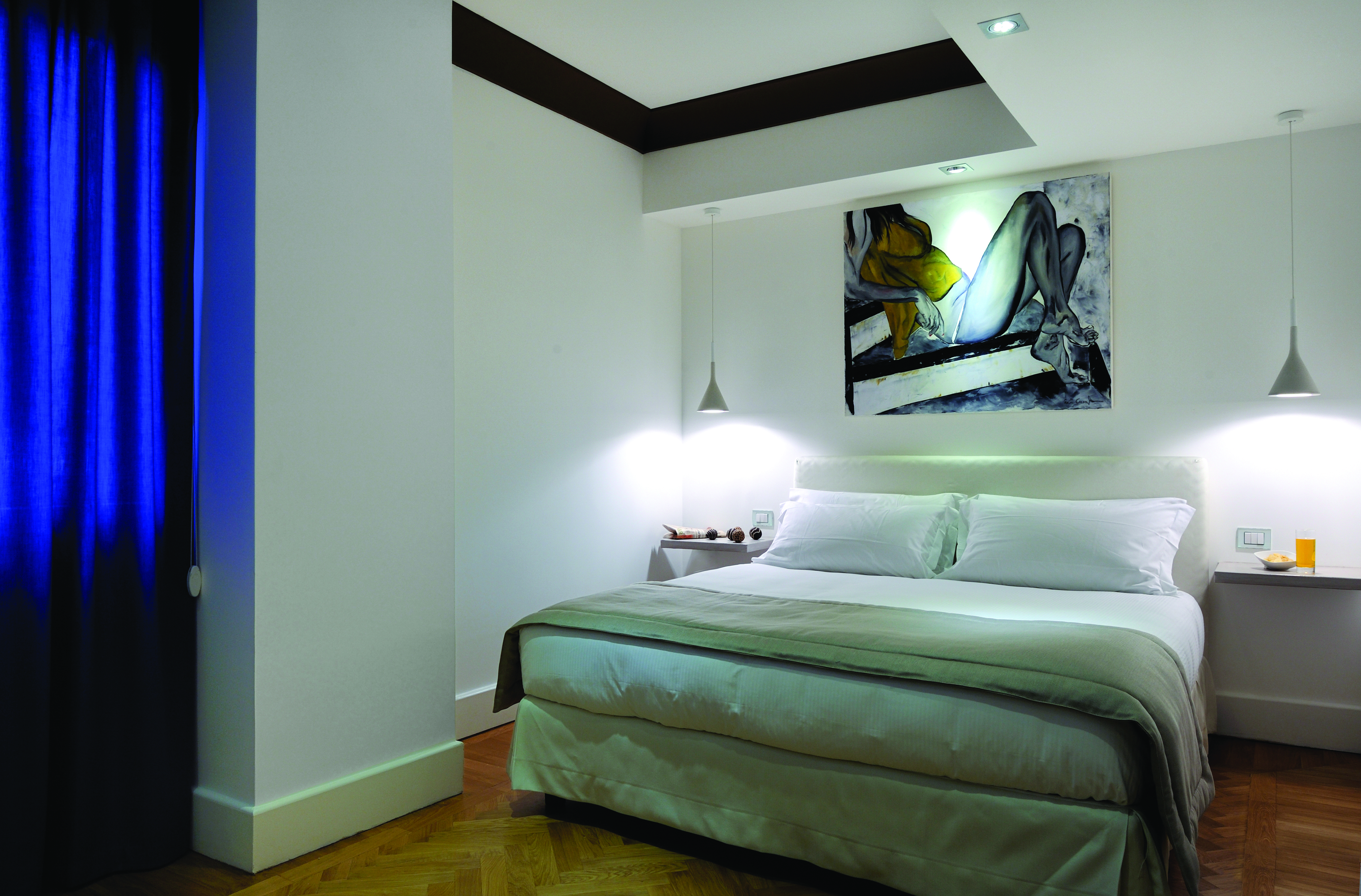 Hotel Principe di Villafranca superior room, double bed, white walls, wooden floors, modern decor