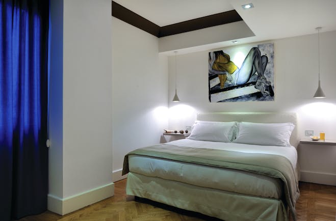 Hotel Principe di Villafranca superior room, double bed, white walls, wooden floors, modern decor