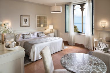 Hotel Villa Belvedere Sicily suite bed sofa contemporary seating area window with sea view