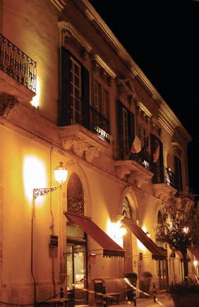 Palazzo Failla Sicily hotel exterior by night street lamp 