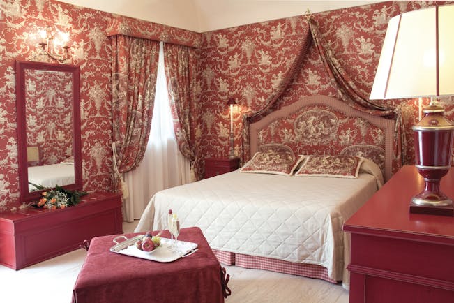 Palazzo Failla Sicily relax room ornate red décor bed mirror lamp