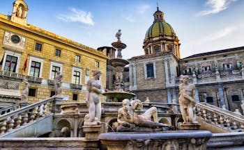 Ornate, Baroque fountain with statues in Palermo