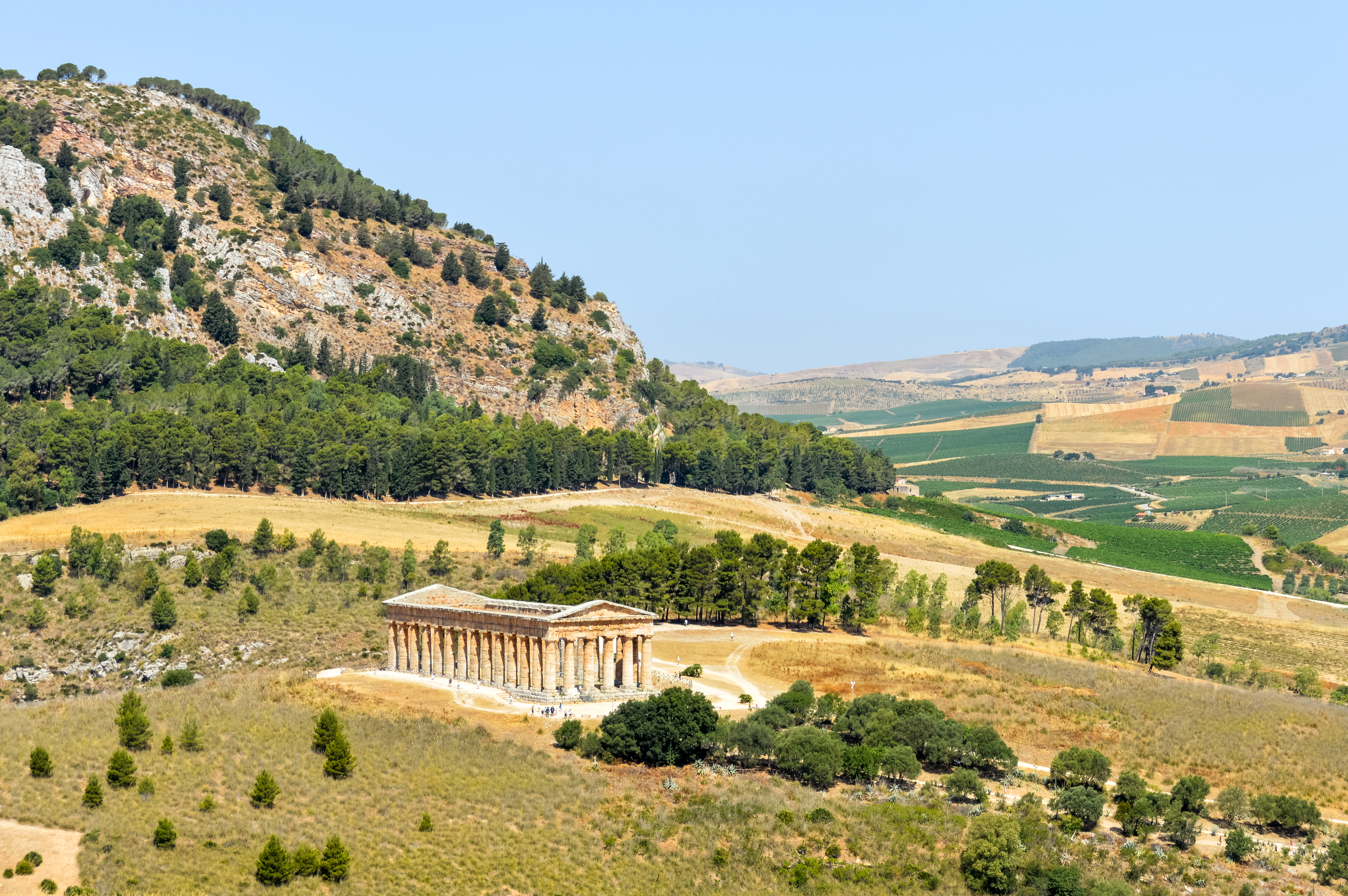 Ancient Greek temple in dry landscape and rocky hills at Segesta in Sicily
