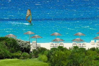 Verdura Resort view of beach with white sand and windsurfer