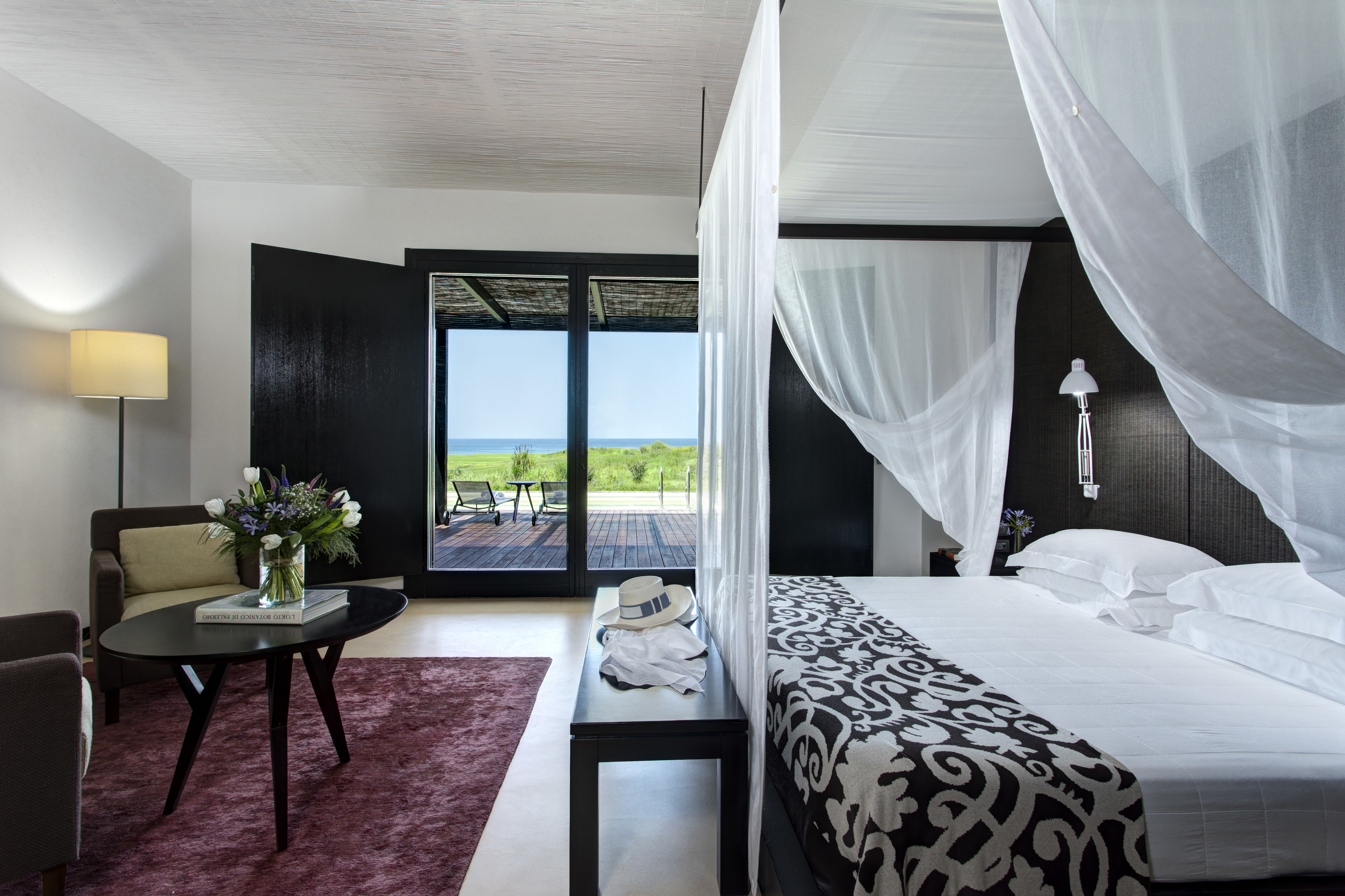 Verdura Resort dark wood and white walls of villa suite peonia