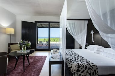 Verdura Resort dark wood and white walls of villa suite peonia