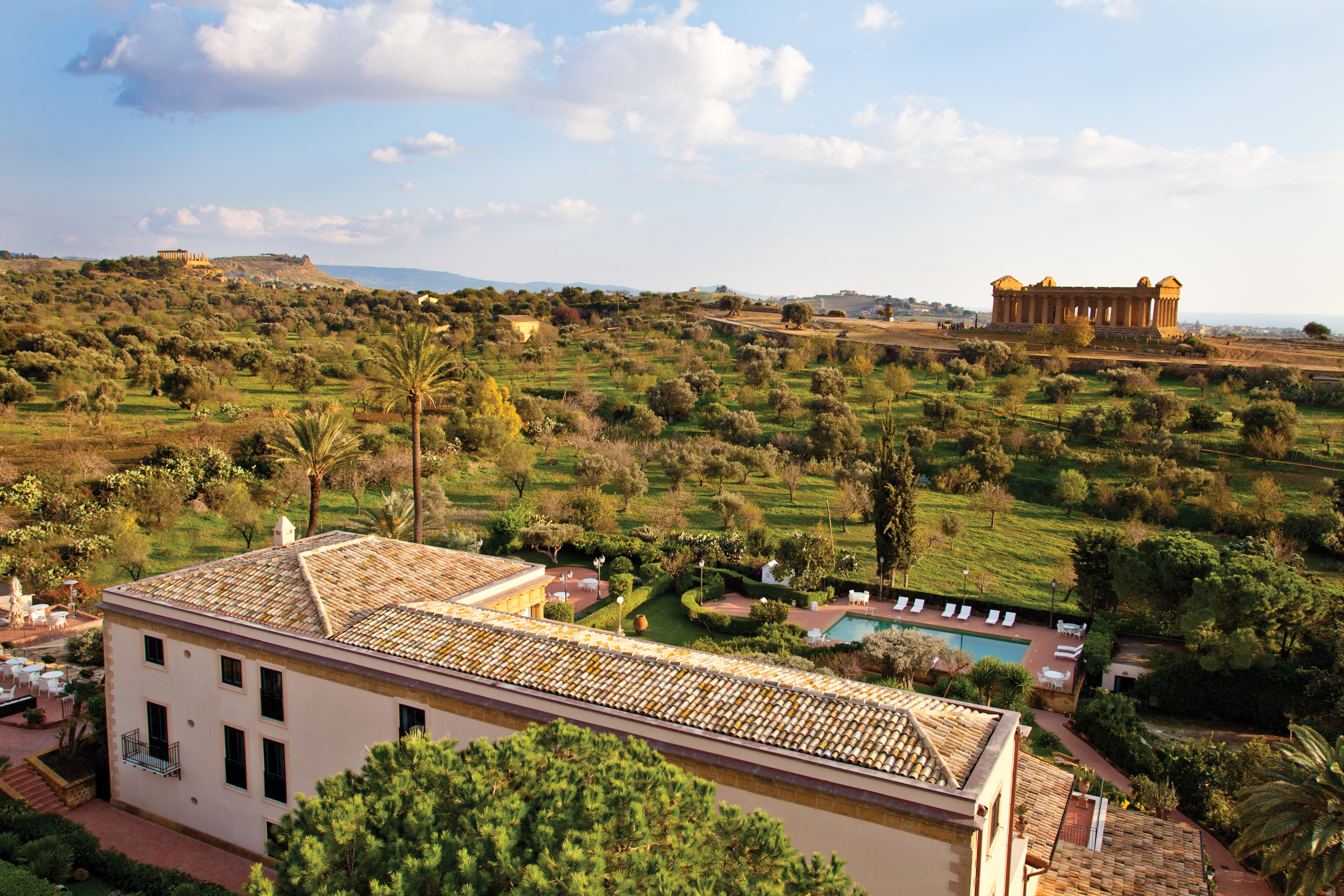 View of temple from the hotel looking out over greenery and onto the temple in the distance