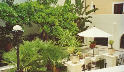 Villa Meligunis Sicily garden trees potted plants patio