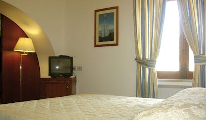 Villa Meligunis Sicily guest room bed television modern décor