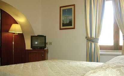 Villa Meligunis Sicily guest room bed television modern décor