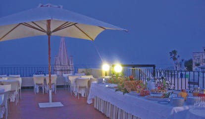 Villa Meligunis Sicily terrace restaurant by night