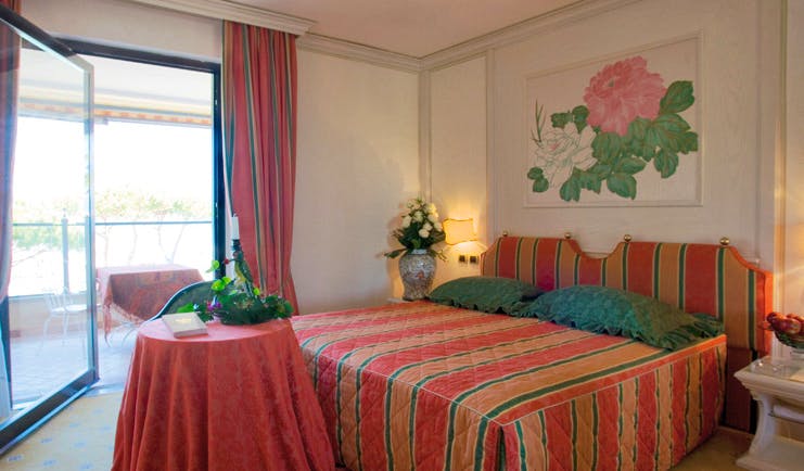 Cala del Porto Tuscany deluxe room bed access to private terrace elegant décor