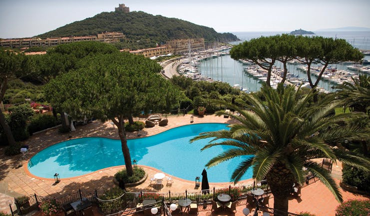 Cala del Porto Tuscany pool aerial shot terrace trees harbour in background