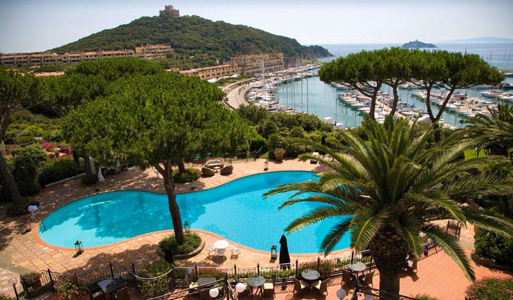 Cala del Porto Tuscany pool aerial shot terrace trees harbour in background