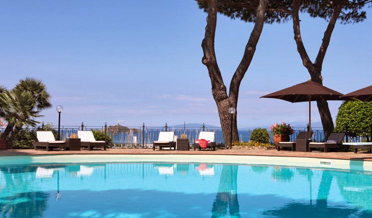 Cala del Porto Tuscany poolside pool terrace sun loungers umbrellas 