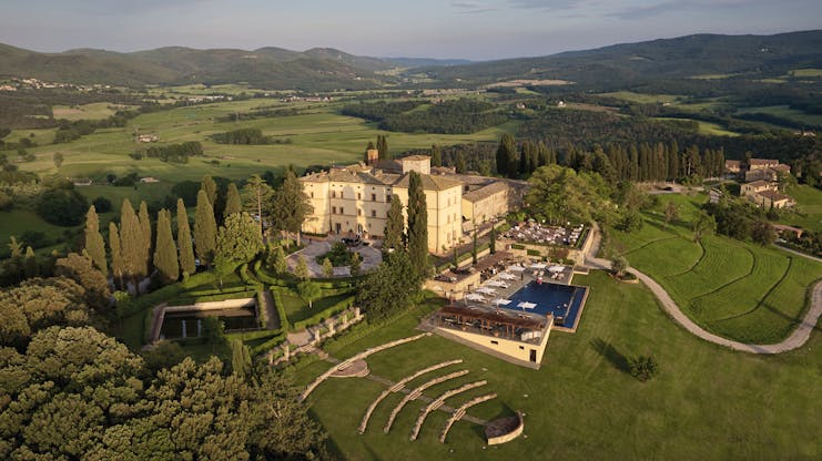 Belmond Castello di Casole Tuscany hotel exterior pool driveway rural surroundings