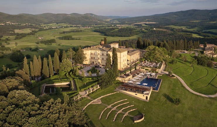 Belmond Castello di Casole Tuscany hotel exterior pool driveway rural surroundings