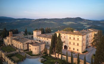 Belmond Castello di Casole Tuscany hotel exterior rural estate in background