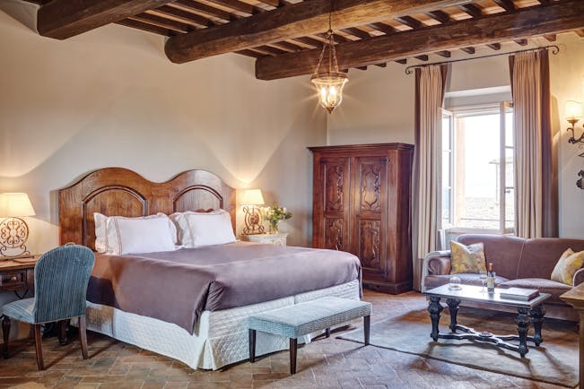 Belmond Castello di Casole Tuscany junior suite bedroom traditional décor