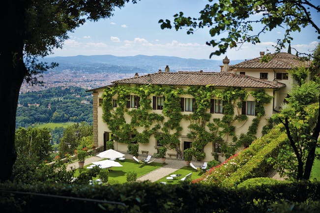 Villa San Michele Tuscany exterior hotel building lawns countryside in background