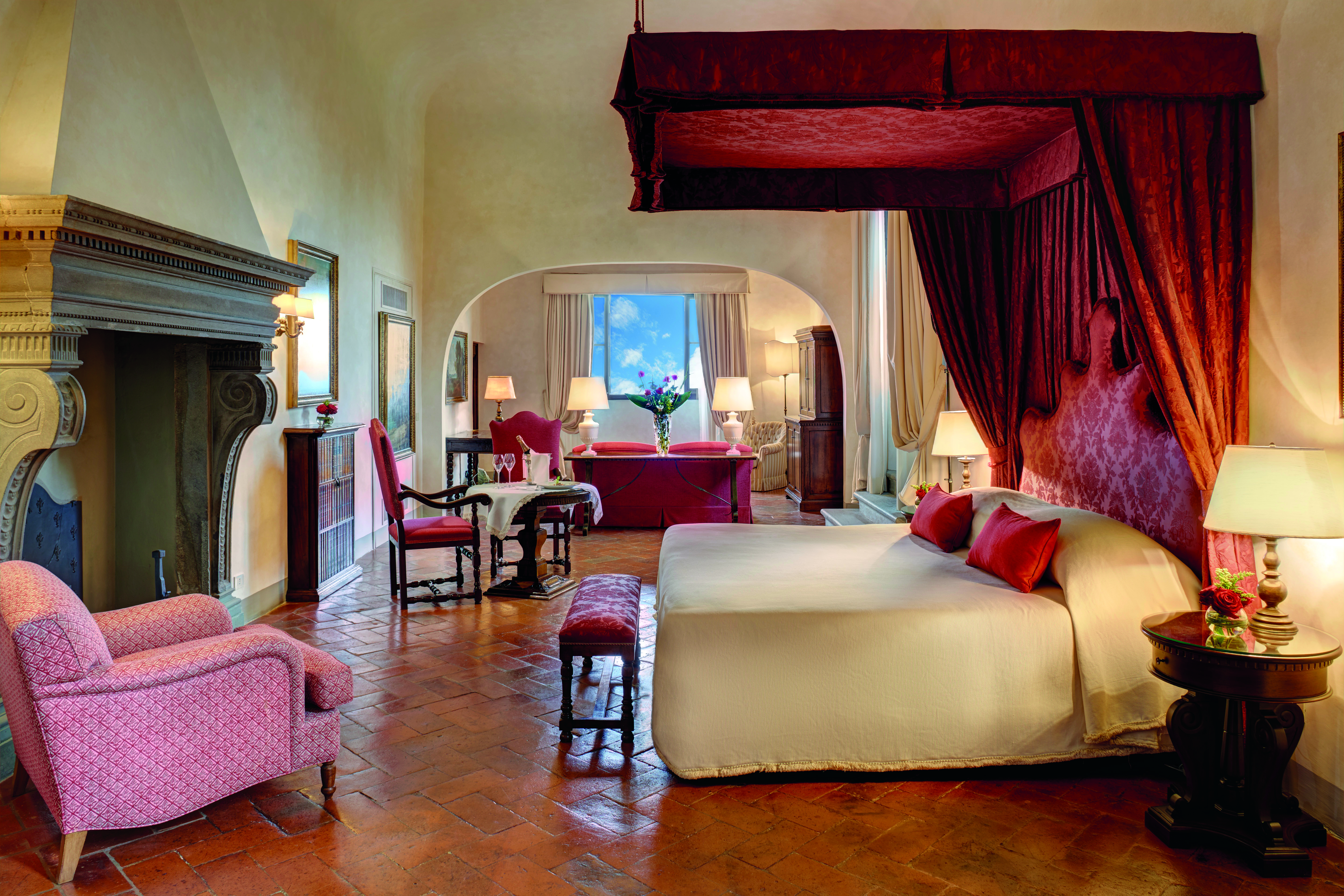 Villa San Michele Tuscany Michelangelo suite canopy bed fireplace ornate décor