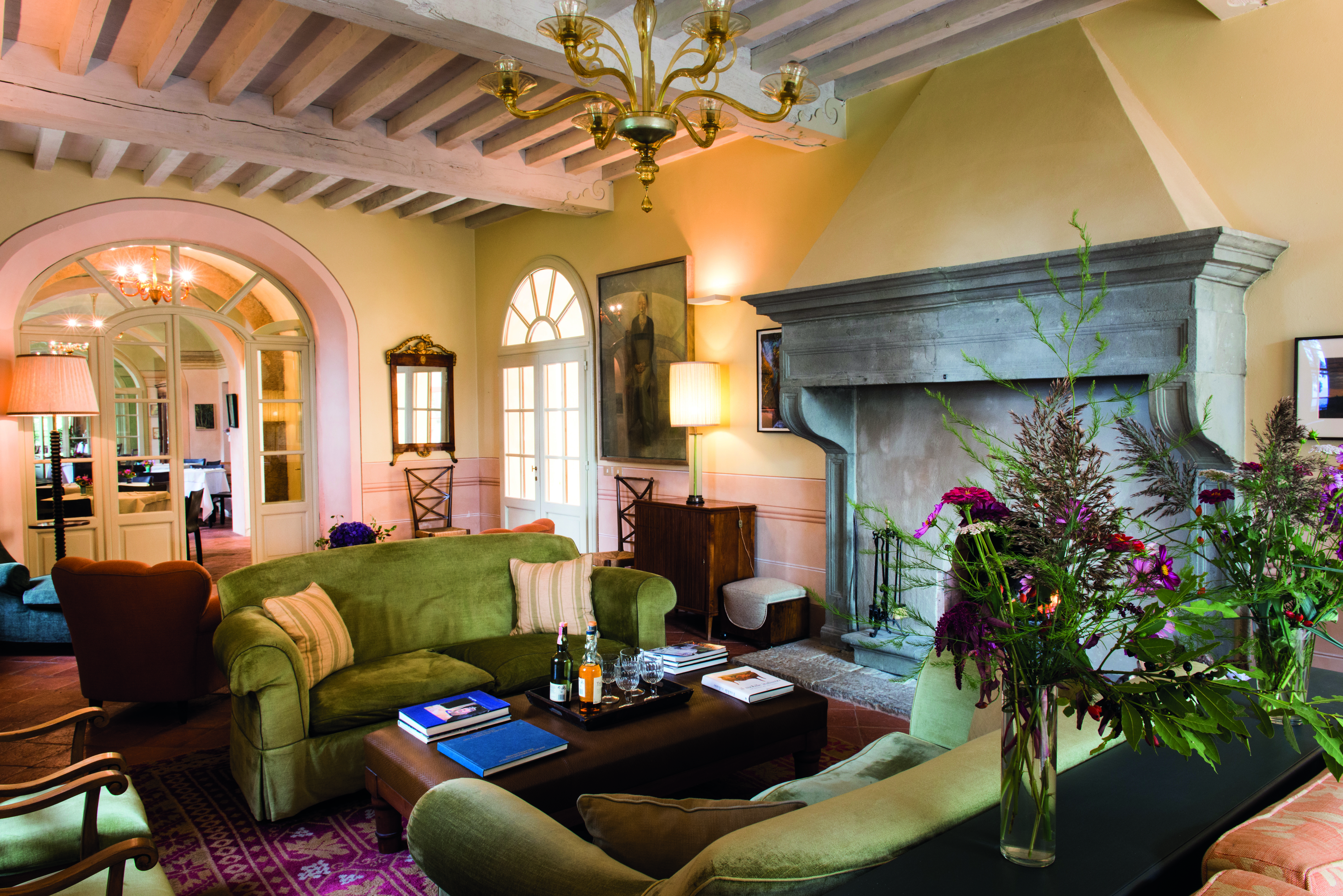 Borgo Pignano Tuscany lounge indoor communal seating area cosy décor