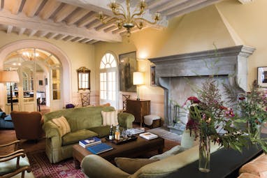 Borgo Pignano Tuscany lounge indoor communal seating area cosy décor
