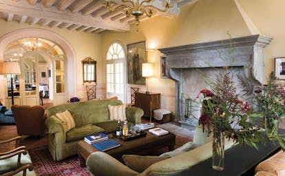 Borgo Pignano Tuscany lounge indoor communal seating area cosy décor