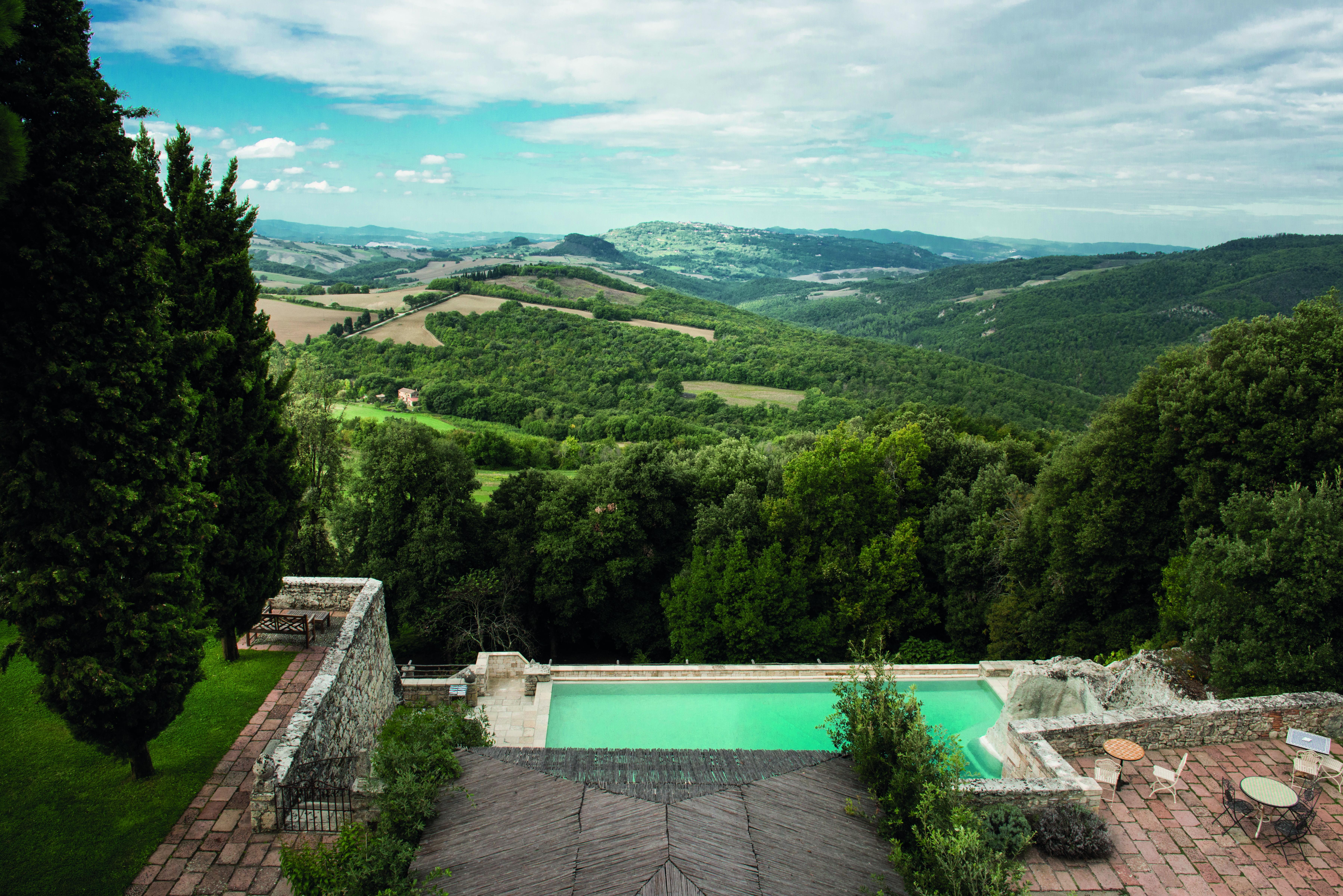 Borgo Pignano Tuscany pool terrace views of Tuscan countryside