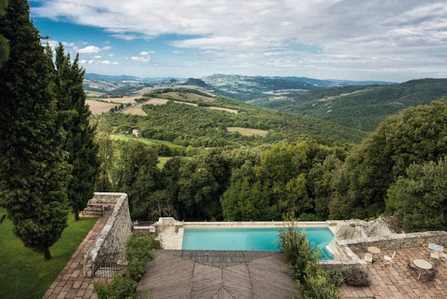 Borgo Pignano Tuscany pool terrace views of Tuscan countryside