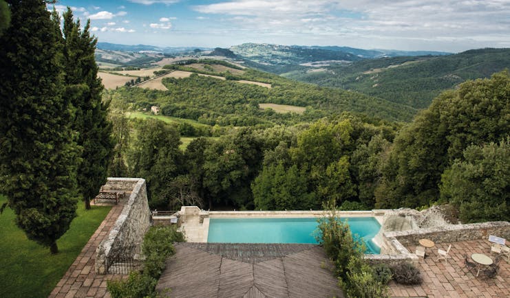 Borgo Pignano Tuscany pool terrace views of Tuscan countryside