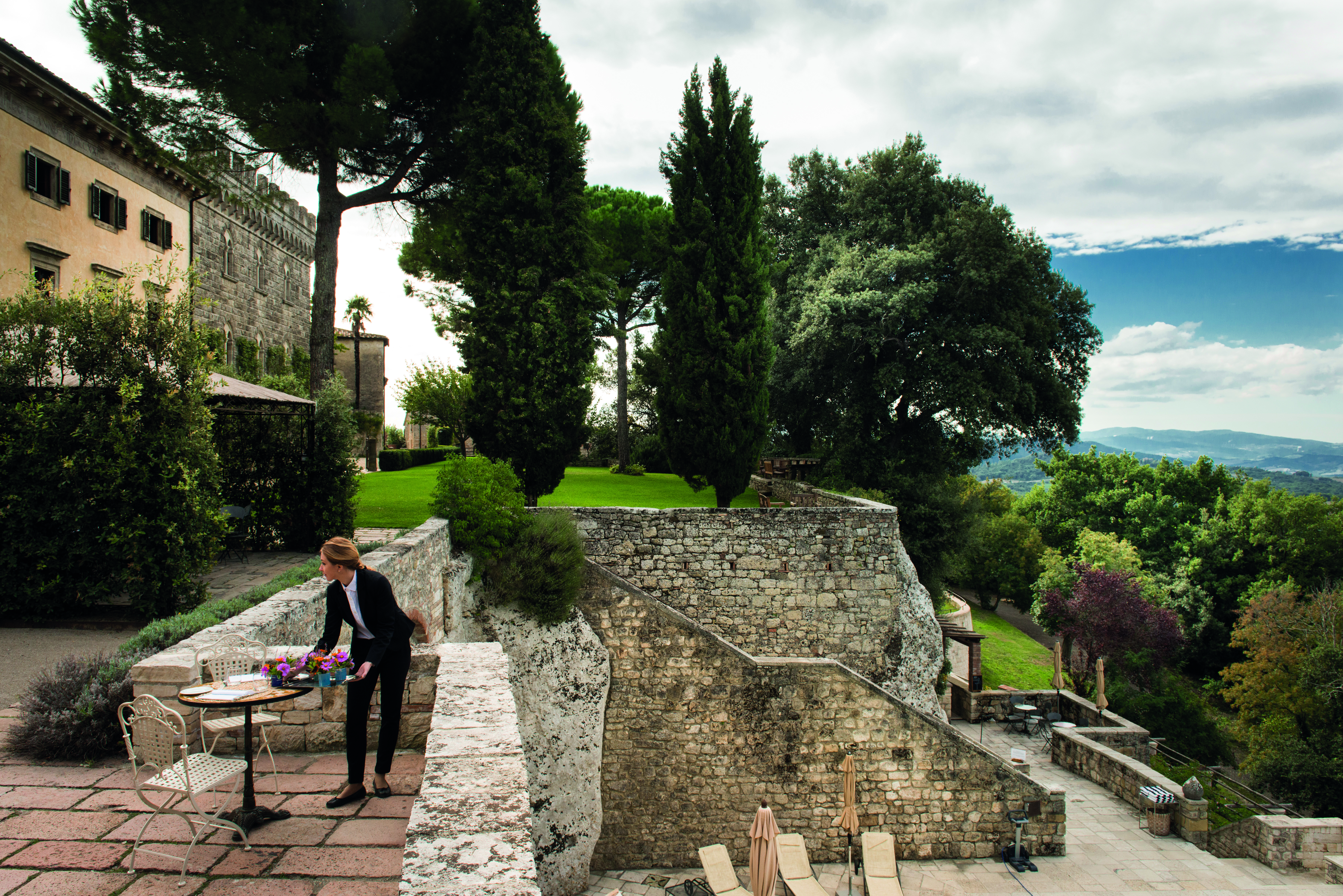 Borgo Pignano Tuscany terrace outdoor dining area countryside views