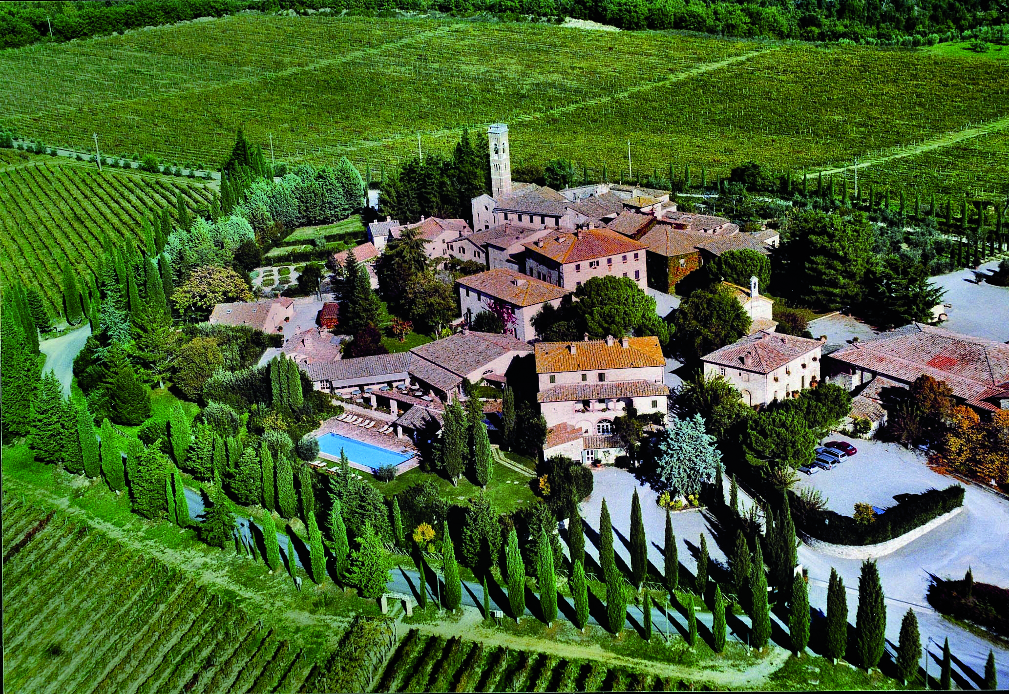 Hotel Borgo San Felice Tuscany aerial shot of resort hotel buildings lawns trees