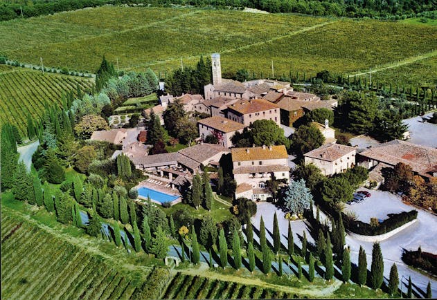 Hotel Borgo San Felice Tuscany aerial shot of resort hotel buildings lawns trees