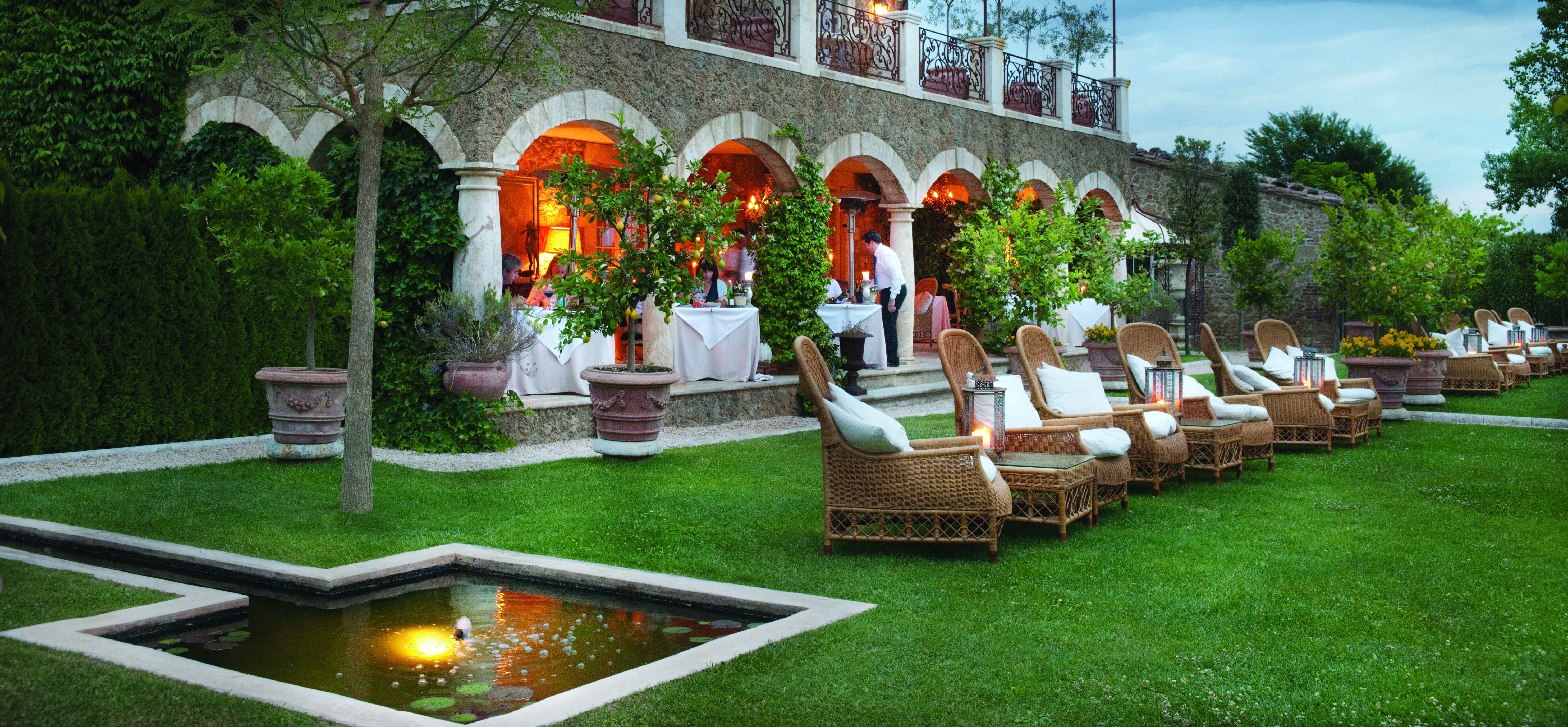 Borgo Santo Pietro Tuscany lawns outdoor seating area terrace restaurant